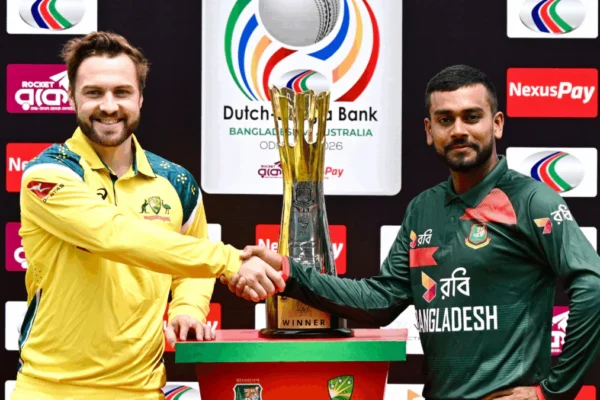Australia and Bangladesh players during an international cricket match with fans, floodlights, and a packed stadium creating an intense atmosphere.