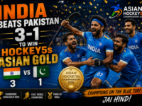 Indian hockey players celebrating with the championship trophy after defeating Pakistan 3-1.