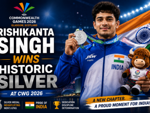 Indian weightlifter Rishikanta Singh celebrating his silver medal on the podium at Glasgow 2026.