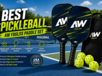 A professional pickleball player holding a high-performance carbon fiber paddle on a sunny outdoor court.